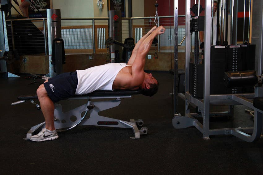 Lying Close-Grip Bar Curl On High Pulley — start position