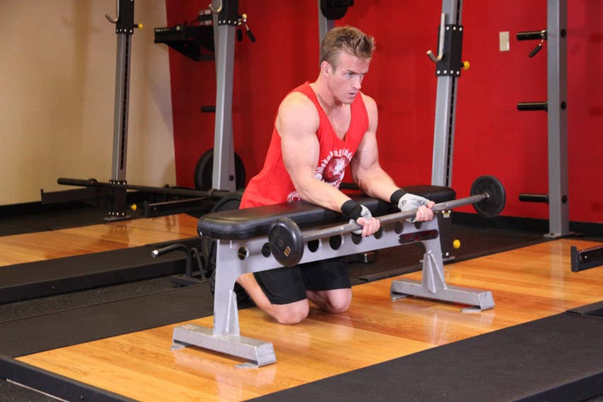 Palms-Up Barbell Wrist Curl Over A Bench — start position