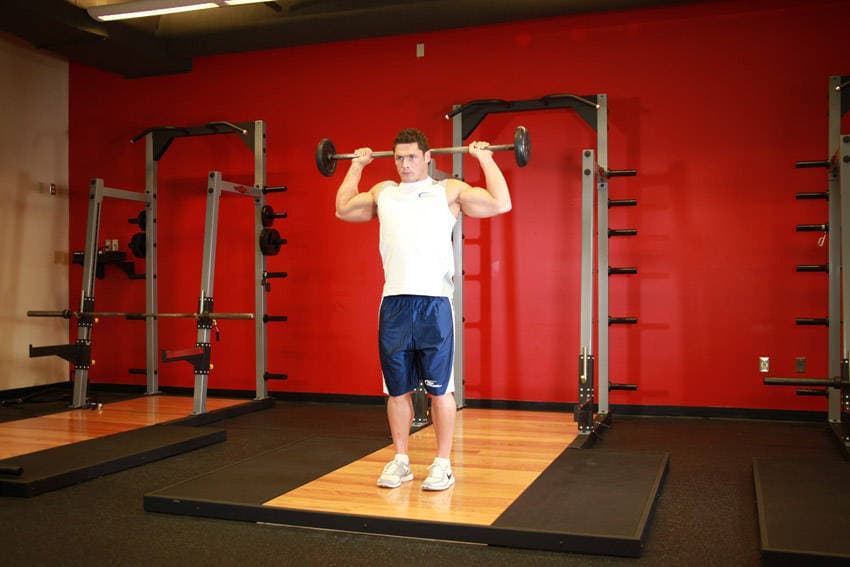 Standing Barbell Press Behind Neck — start position