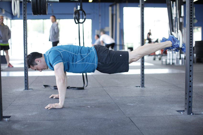 Suspended Reverse Crunch — start position