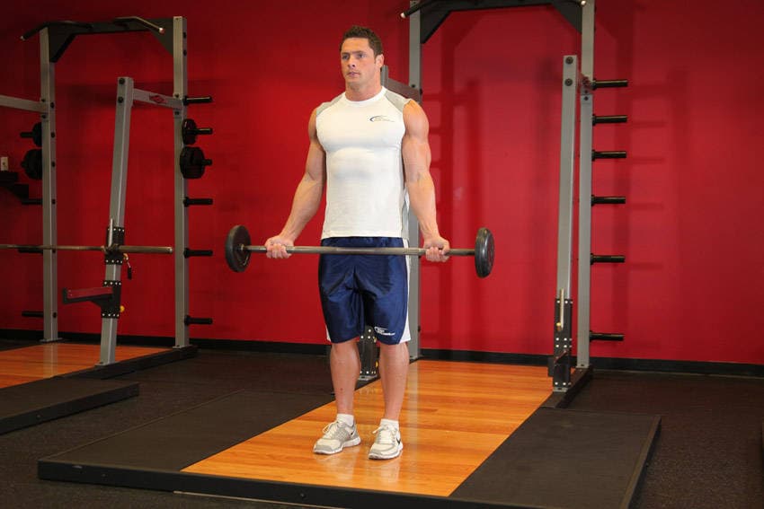 Wide-Grip Standing Barbell Curl — start position